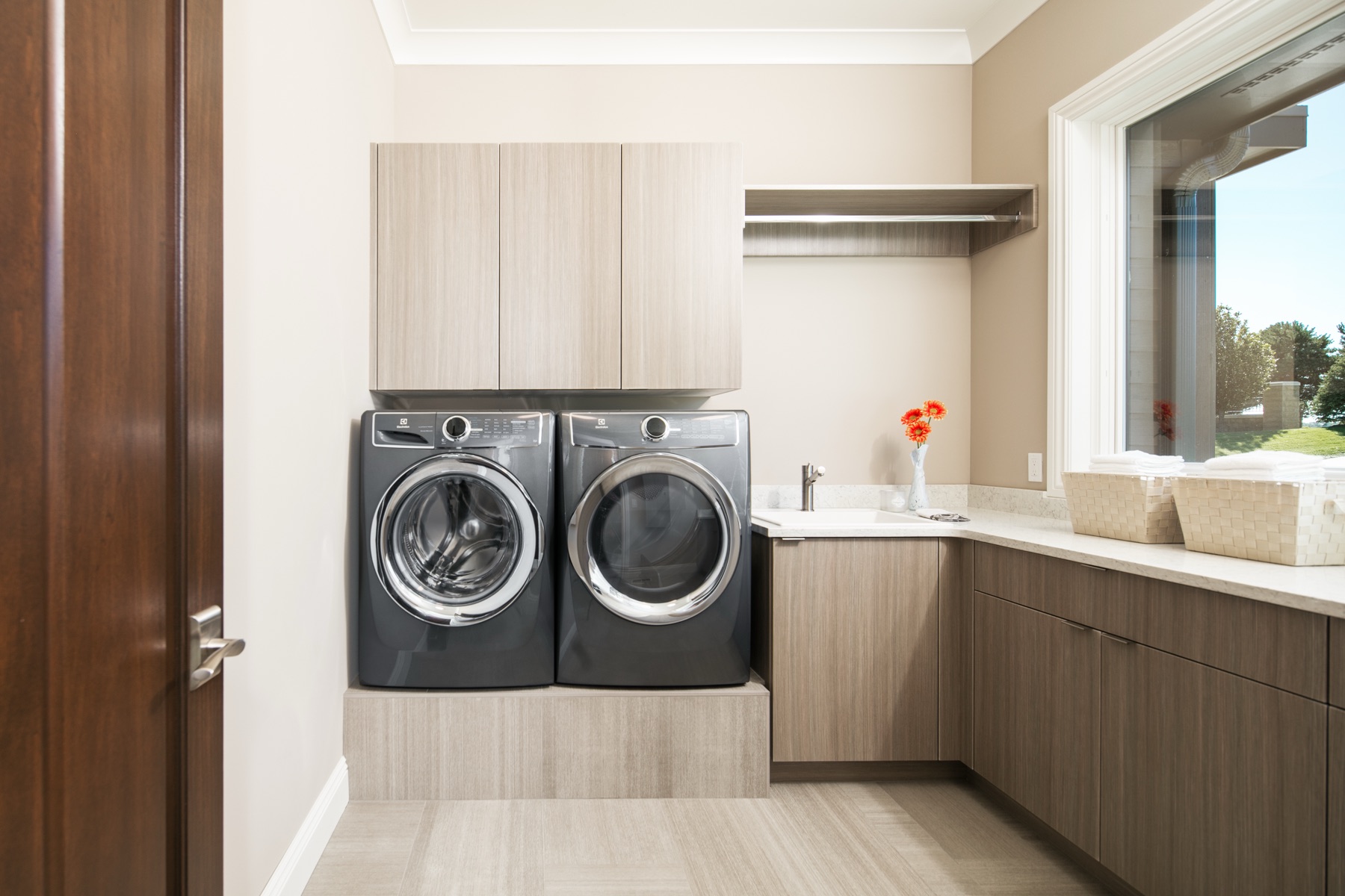 Custom laundry and storage cabinetry by Eurowood
